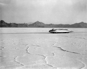 Dick Whittington Studio - John Cobb breaking land speed record, Bonneville Salt Flats, Utah, 1939